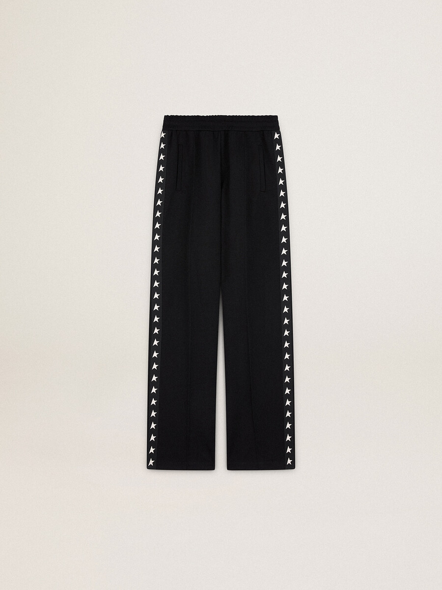 calça de moletom feminina preta com estrelas brancas nas laterais.