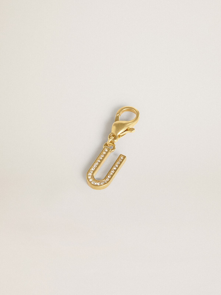 pingente com a letra u em latão dourado com cristais.