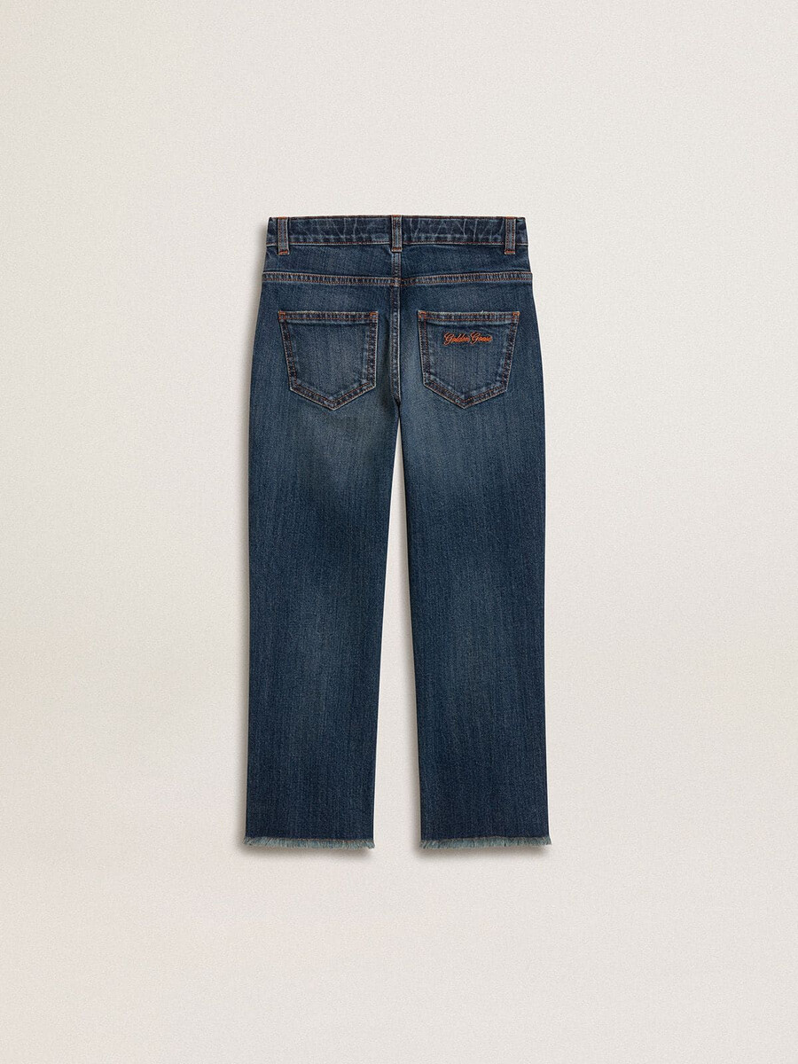 calça jeans infantil com barra desfiada e bordado.