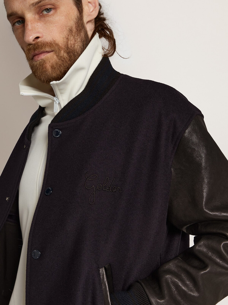 jaqueta bomber masculina em lã azul e couro preto.