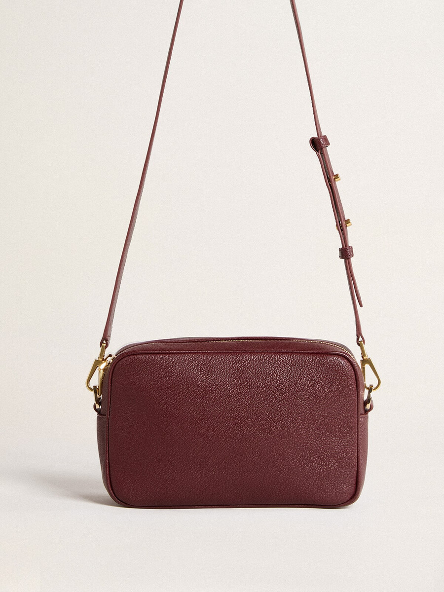 bolsa star em couro vermelho-vinho com estrela tom sobre tom