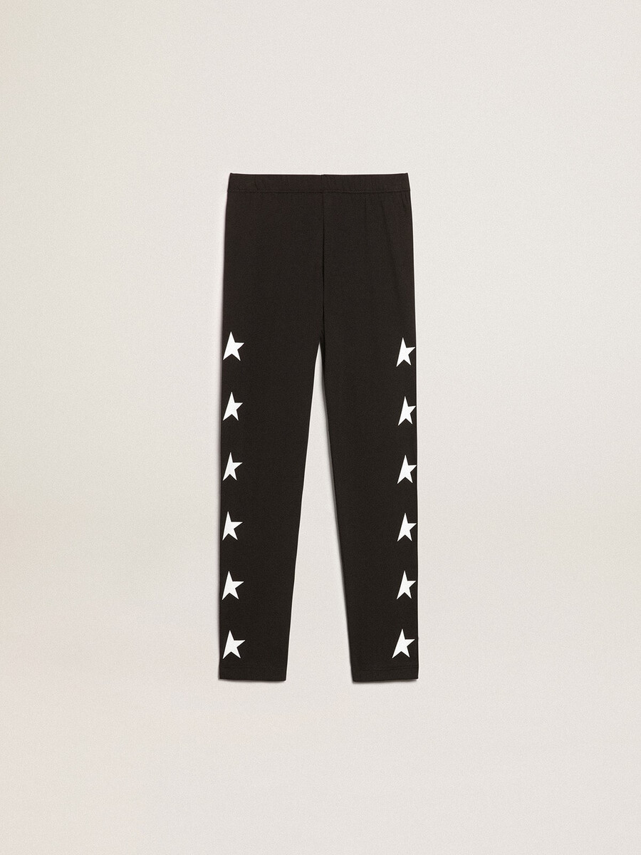 leggings pretas infantis com estrelas brancas nas laterais.