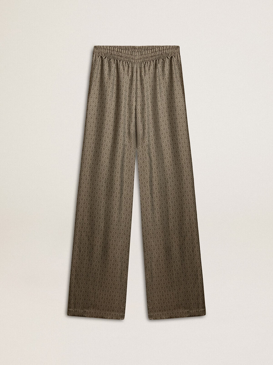 calça feminina verde em viscose e seda com estampa floral.
