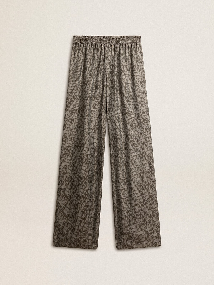 calça feminina verde em viscose e seda com estampa floral.