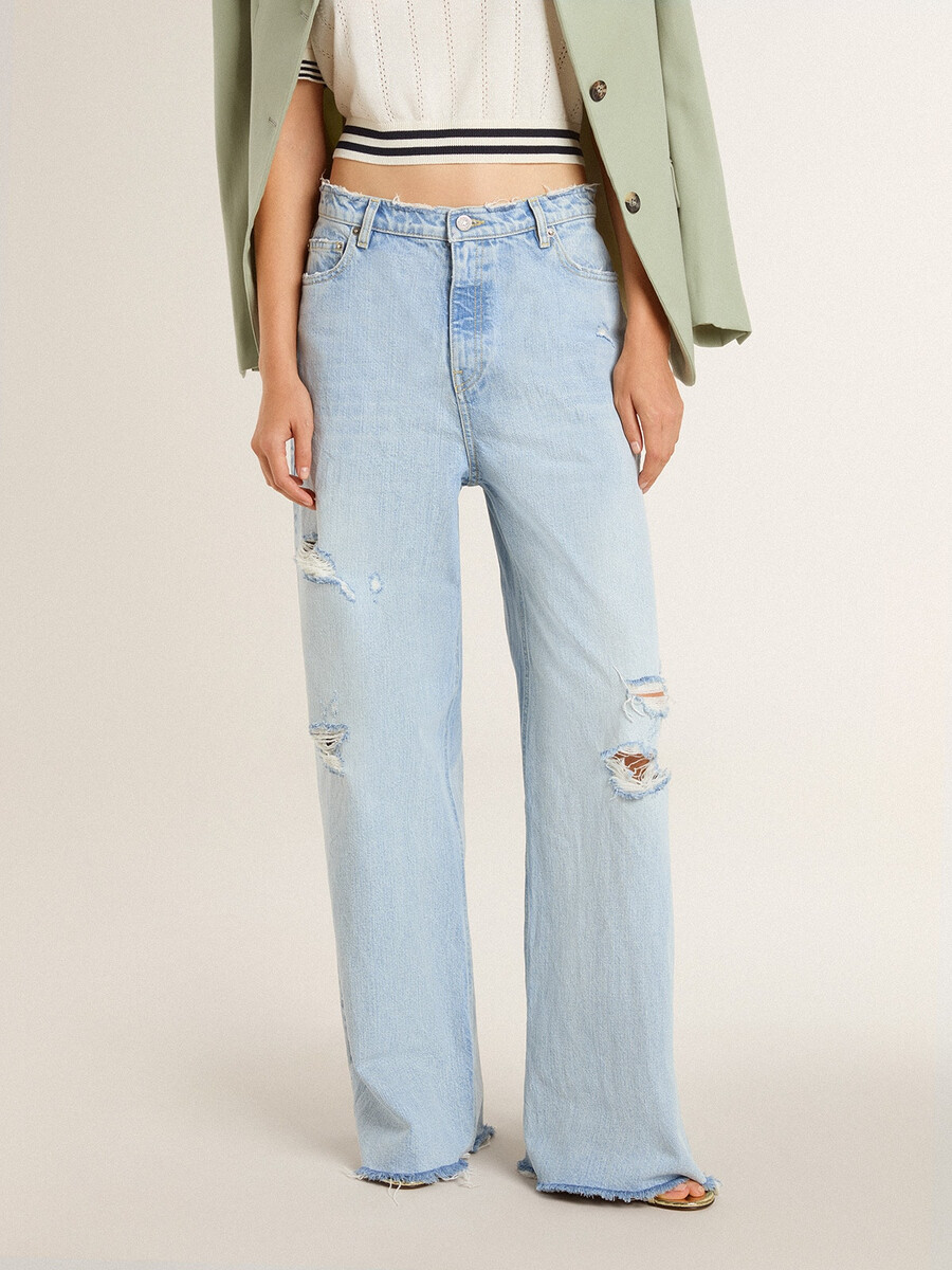 calças femininas em denim com efeito desgastado