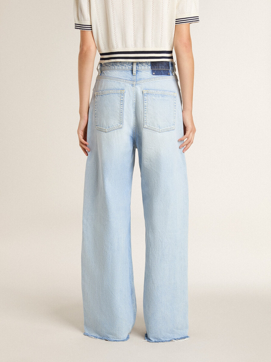 calças femininas em denim com efeito desgastado