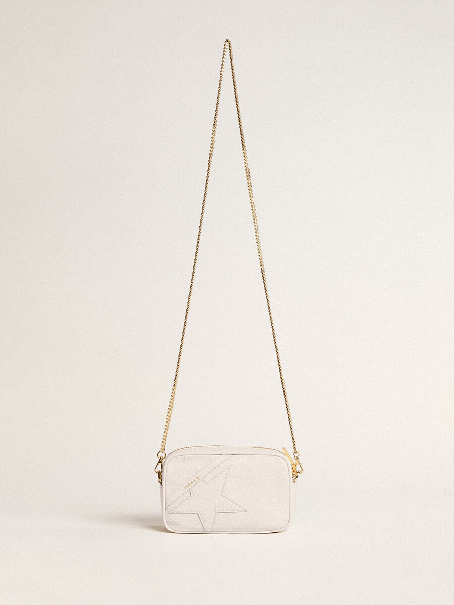 mini bolsa star em couro branco-manteiga com estrela tom sobre tom