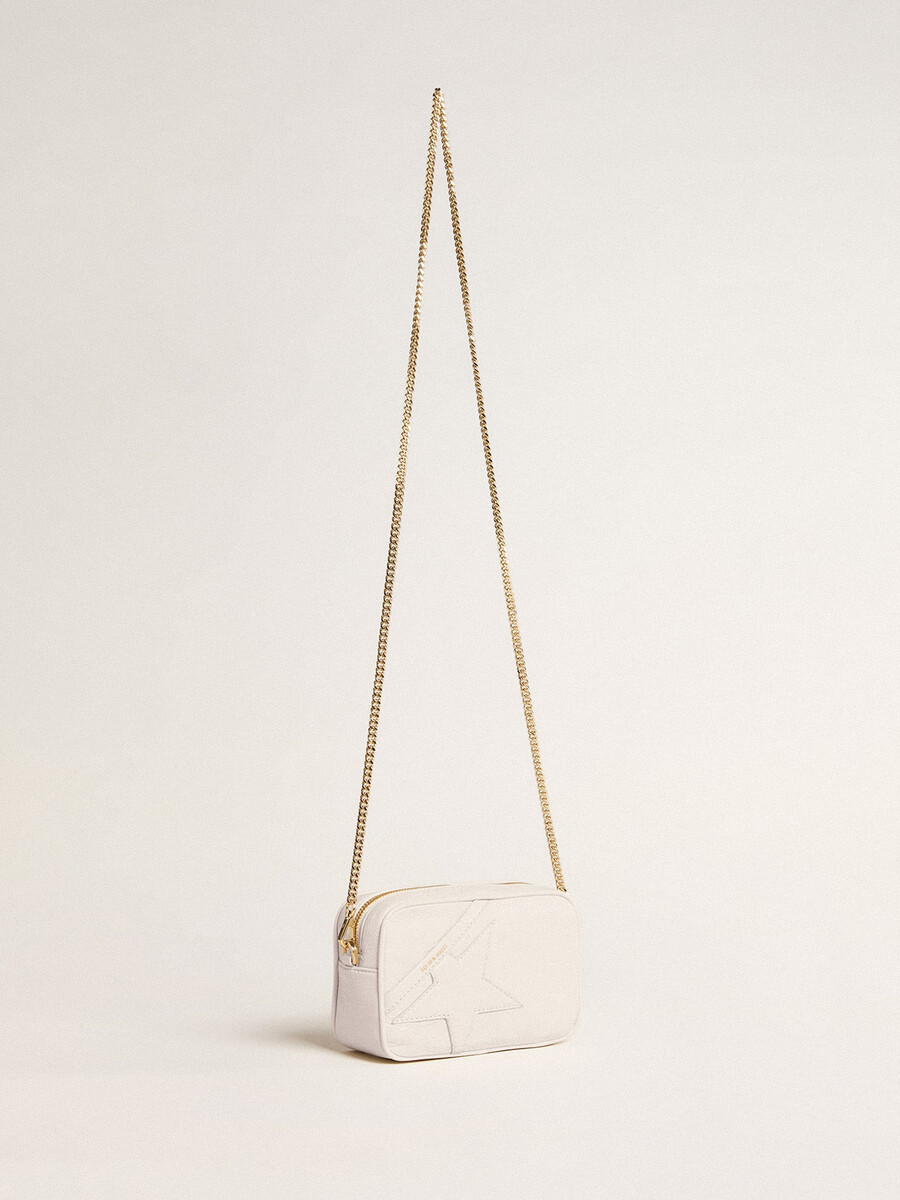 mini bolsa star em couro branco-manteiga com estrela tom sobre tom