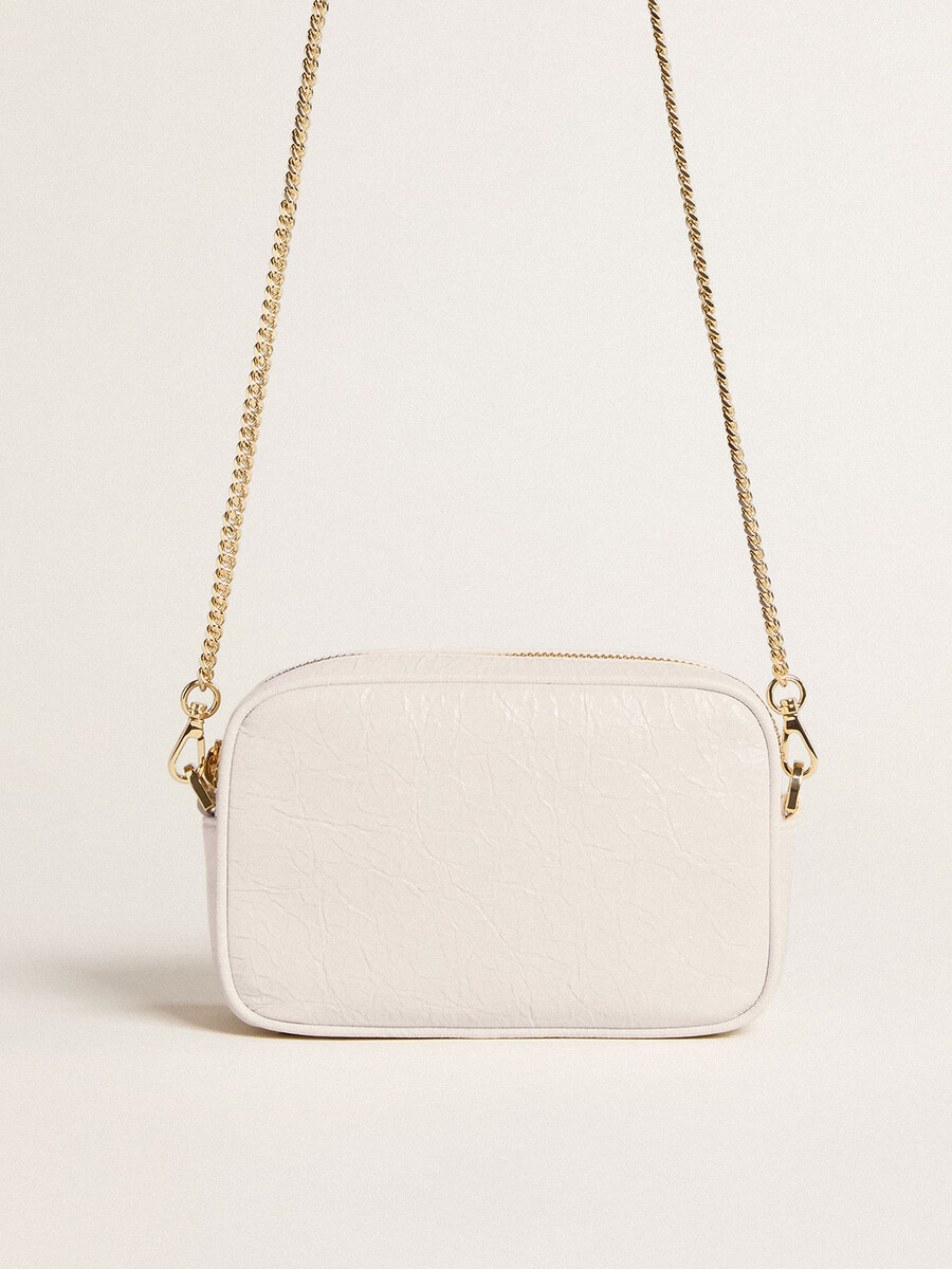 mini bolsa star em couro branco-manteiga com estrela tom sobre tom