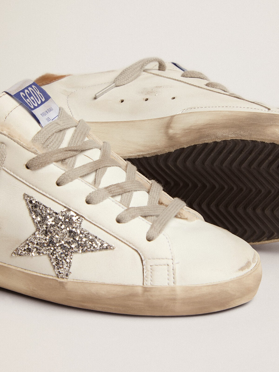 super-star feminino com forro de pele de carneiro e estrela prateada com glitter.