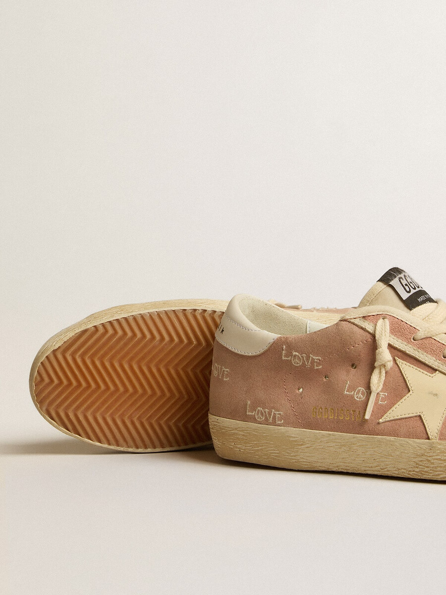 super-star feminino em camurça rosa-claro com estrela em couro creme