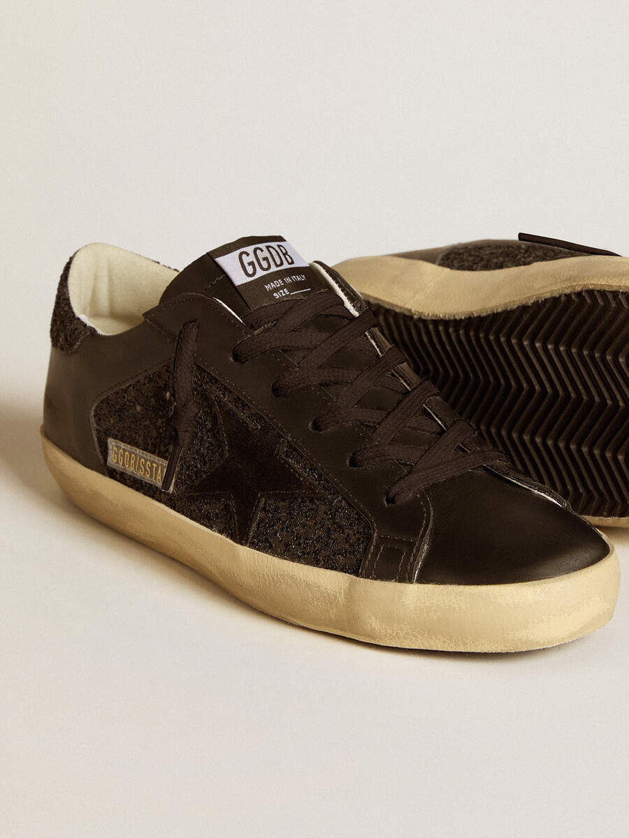 super-star feminino em glitter preto com estrela em camurça preta e detalhes em couro.