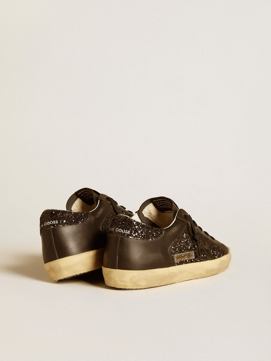 super-star feminino em glitter preto com estrela em camurça preta e detalhes em couro.