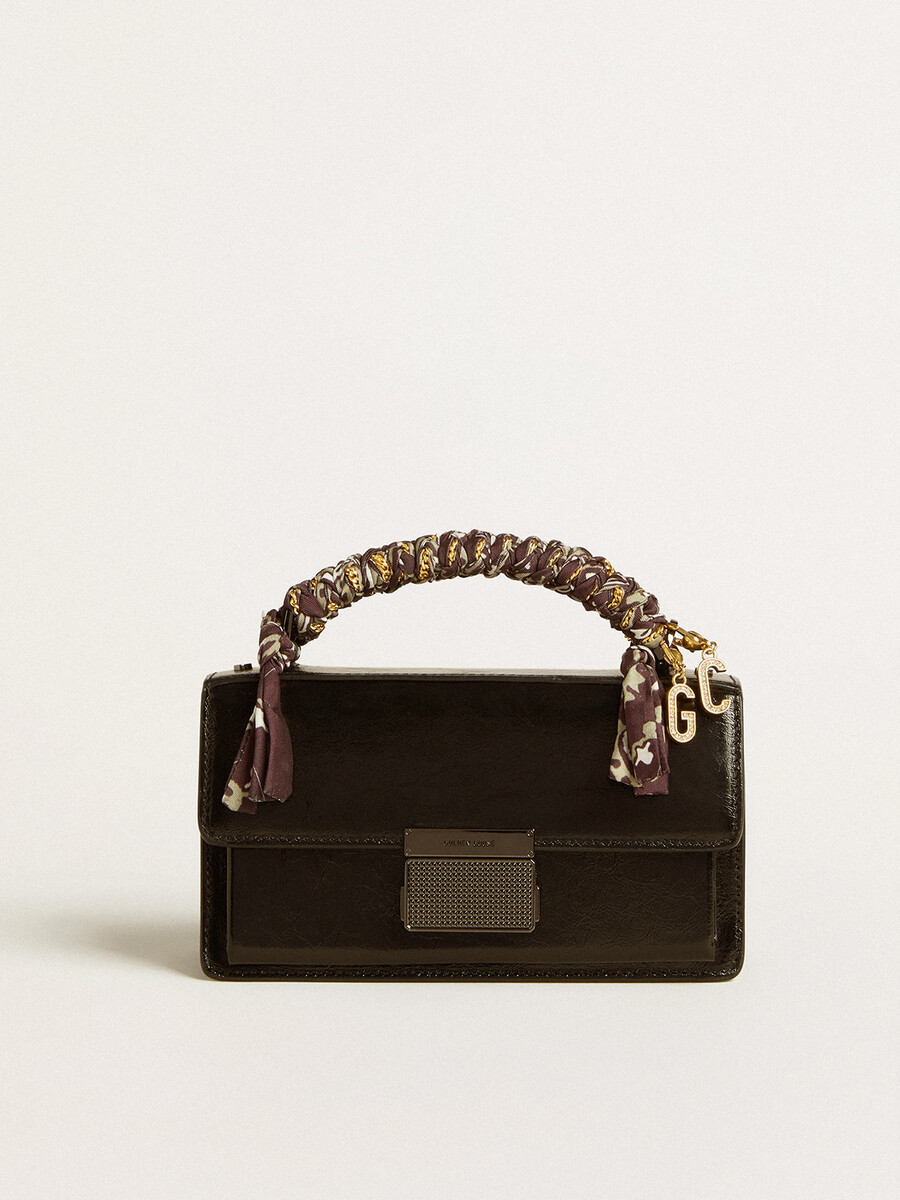 bolsa pequena venezia em couro metalizado preto com detalhes em preto.
